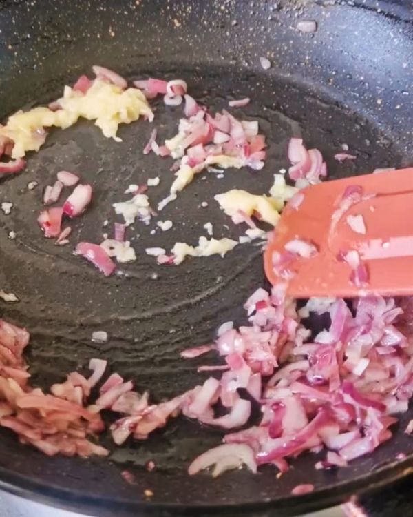 Step 4.1: In the same pan, heat olive oil and sauté the diced onion until translucent