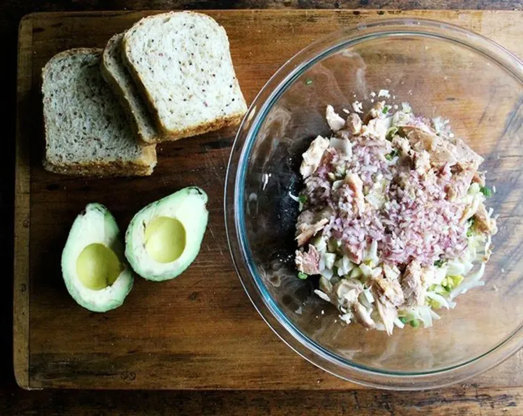 Step 2.1: Pour the dressing over the salad and gently toss everything together, keeping the trout in large pieces