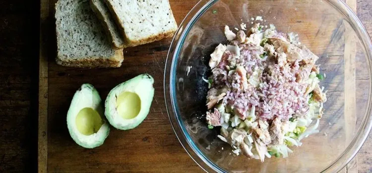 Step 2.1: Pour the dressing over the salad, and use your hands to gently toss everything together, keeping the trout in large pieces