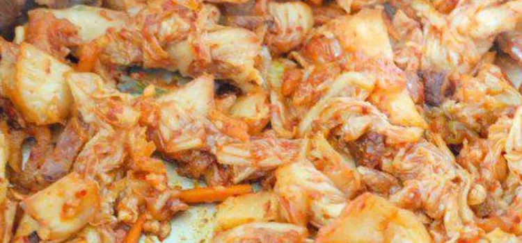 Step 2.1: Add oil to the hot pan, cook the kimchi for a minute, then add in bacon
