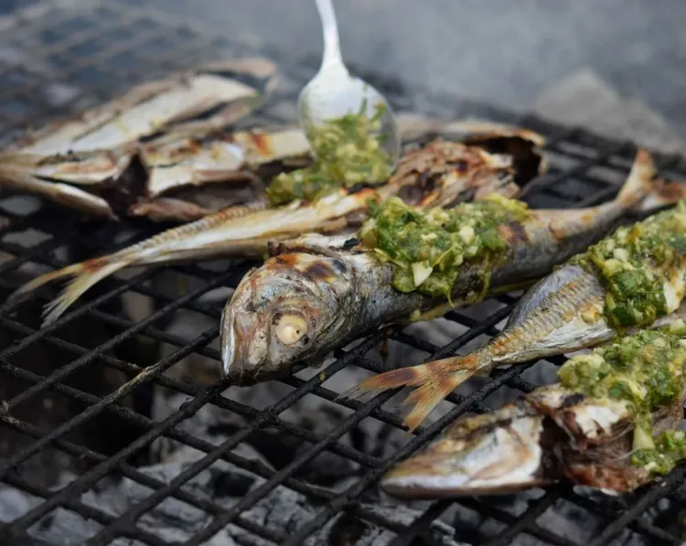 Step 2.1: Once cooked, remove the head and spine of each fish, opening them up like a book