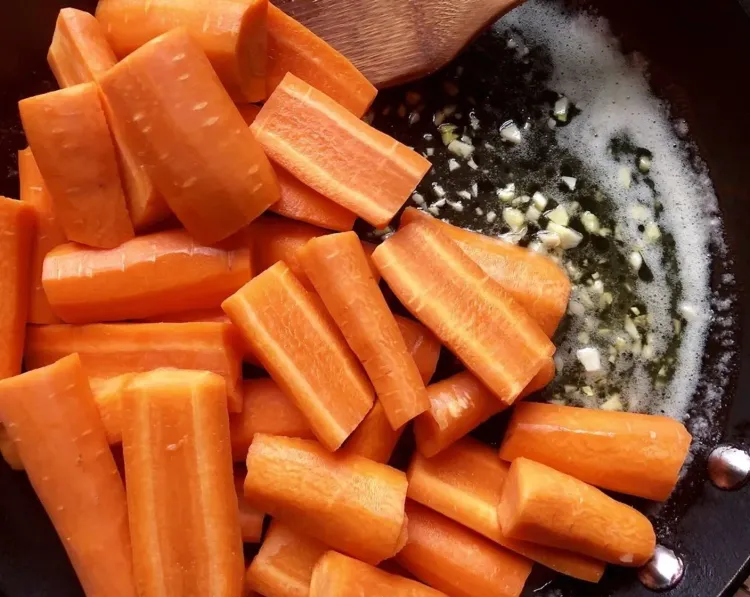 Step 2.1: Add the carrot pieces and allow the sauce to thicken for a further minute while tossing the carrots through the sauce so that they are evenly coated