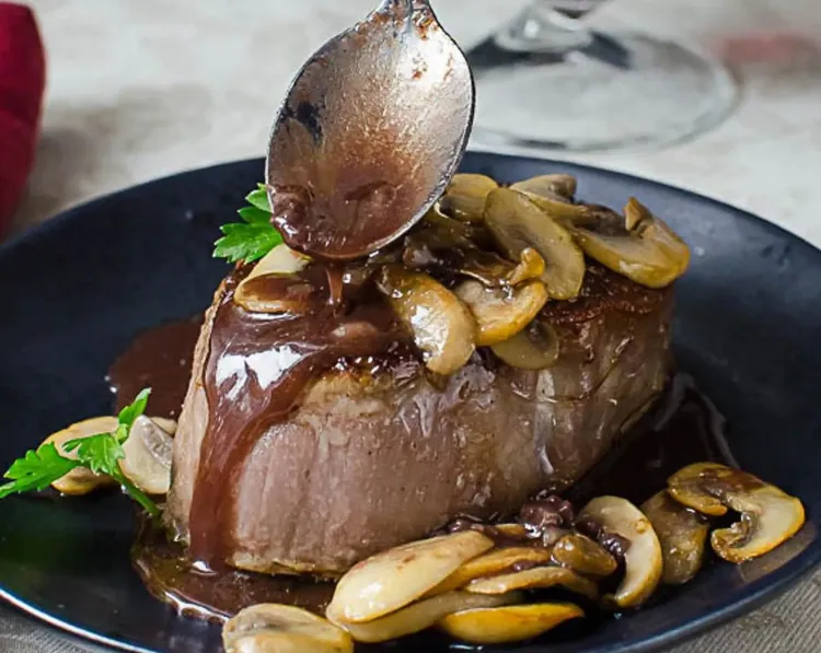 Step 2.1: While the steak rests, heat the Bordelaise sauce and stir in the mushrooms