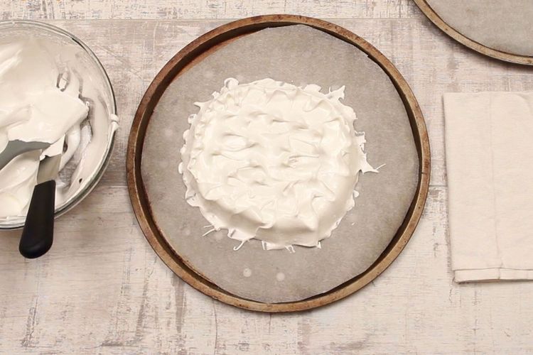 Step 1.1: Divide the meringue mixture evenly into the two circles
