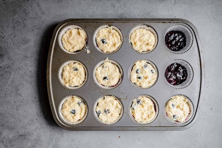 Step 2.1: Pipe the blueberries into the middle of each muffin