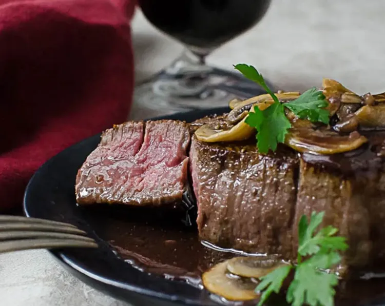 Step 2.1: Spoon the sauce over the steaks and serve