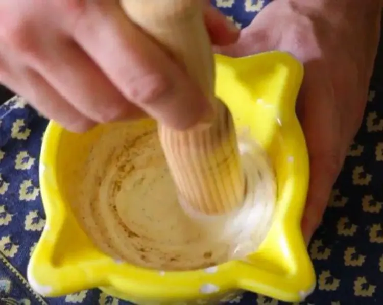 Step 1.1: Using a pestle, pound the garlic until it forms a paste
