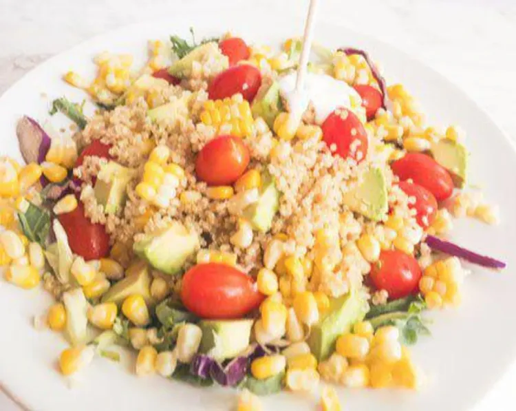 Step 2.1: In a large bowl, combine salad greens, cooked quinoa, sliced avocado, cherry tomatoes, and corn