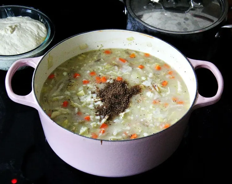 Step 2.1: When the mixture simmers, add the cabbage, diced carrots, diced potatoes, kosher salt, freshly ground black pepper, caraway seeds, white balsamic vinegar, and granulated sugar