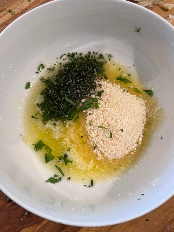 Step 3.1: When the bread is finished baking, remove from the oven and use a pastry brush to apply the herb garlic butter