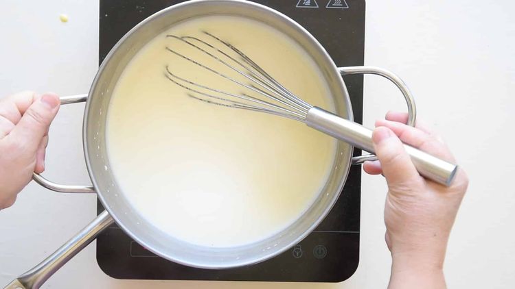 Step 1.1: Heat fresh milk and castor sugar in a double boiler until the sugar is dissolved