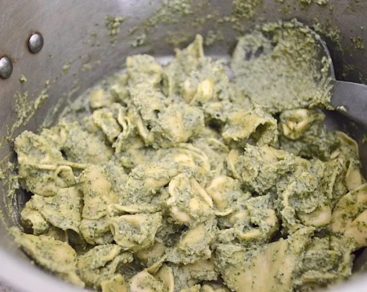 Step 1.1: Toss the tortellini with the pesto, then add the reserved cooking water and an extra drizzle of olive oil