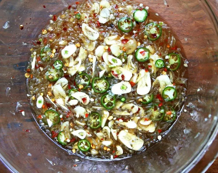 Step 2.1: Add minced garlic and sliced Thai chili peppers