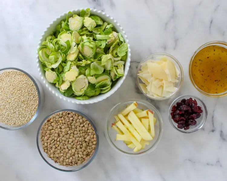 Step 3.1: While the lentils and quinoa cook, combine Brussels sprouts, apple, dried cranberries, and shredded Parmesan cheese in a large bowl