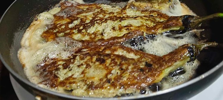 Step 1.2: Heat canola oil in a pan