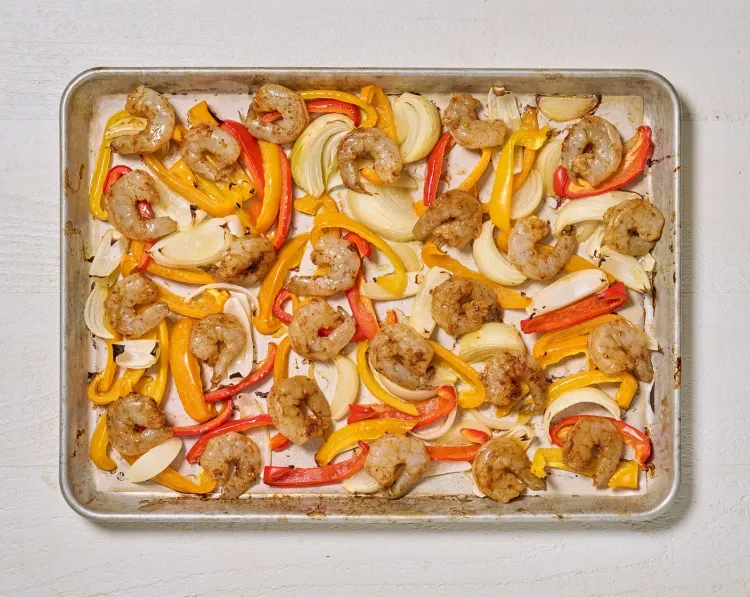 Step 2.1: Add the seasoned shrimp to the same sheet pan, return to the oven and bake for 5 more minutes