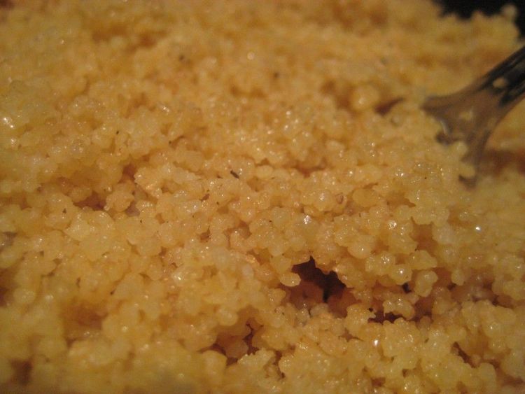 Step 3.2: After 5 minutes, fluff the couscous with a fork and drizzle with olive oil