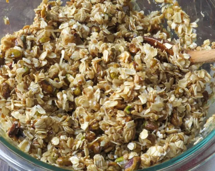 Step 4.1: Pour the honey mixture over the oats and stir until thoroughly combined