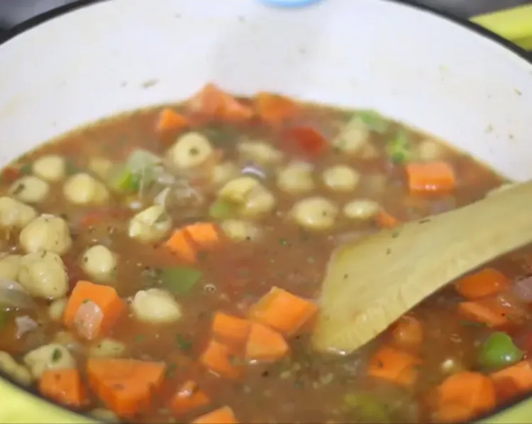 Step 1.1: Add water or veggie stock, then mix everything together until the tomato paste is dissolved
