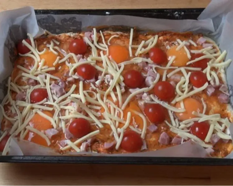 Step 2.1: Line a baking tray with baking paper and press the dough inside until it reaches all the corners