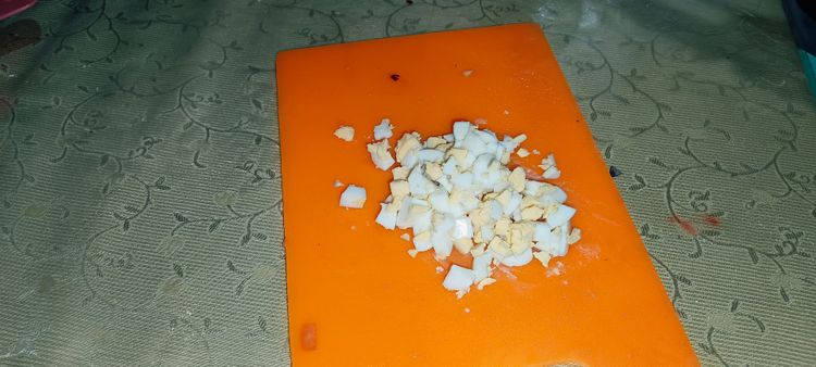 Step 1.1: Peel the boiled eggs and chop them into cubes