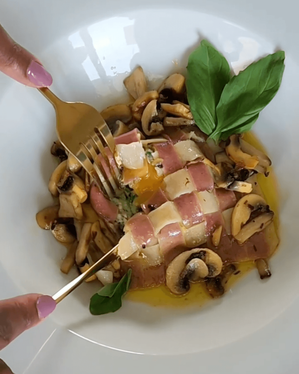 Step 8.1: Plate the ravioli and mushrooms together, garnishing with fresh herbs if desired