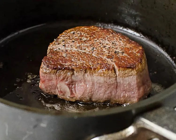 Step 2.1: Flip the steaks and cook for an additional 1