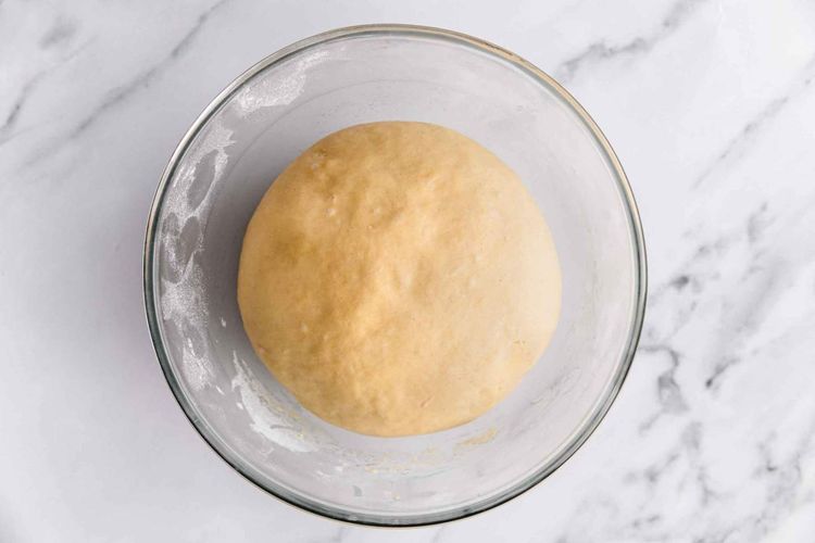 Step 2.1: Cover the bowl with cling film or a kitchen towel and set aside to proof at room temperature for 45 minutes