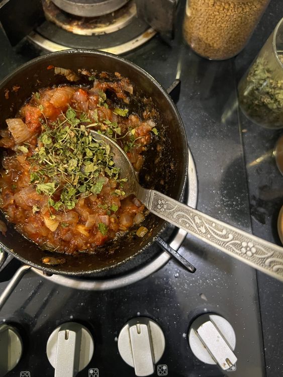 Step 3.1: Add the chopped onions and sauté until slightly brown, followed by the chopped tomatoes until soft