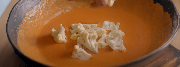 Step 1.1: Add the cauliflower into the batter and coat well