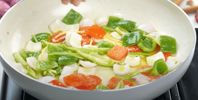 Step 2.1: Add green chillies, ginger, tomato, onion, capsicum, and mix well