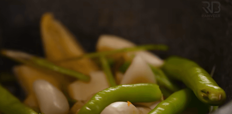 Step 2.1: In a mortar pestle, add ginger, garlic, green chillies, and salt to taste
