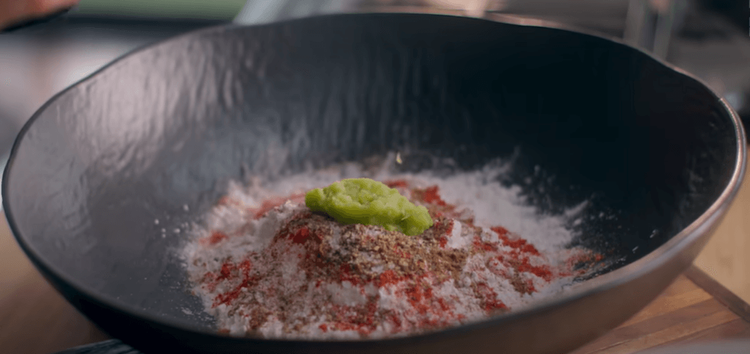 Step 1.1: To make the batter, add rice flour, corn flour, all the powdered spices, salt, green paste, curry leaves, and curd into a large bowl