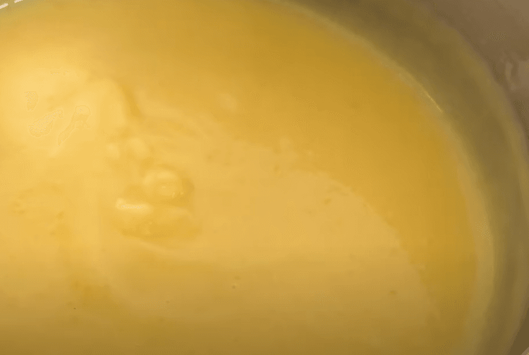 Step 1.1: Fold in the mango puree into the cooled mixture