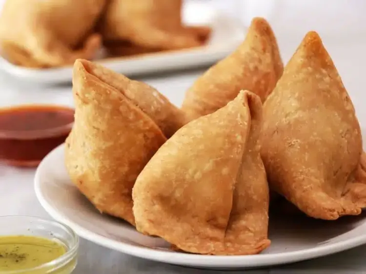 Step 2.1: Deep fry the samosas in hot oil until crisp and brown