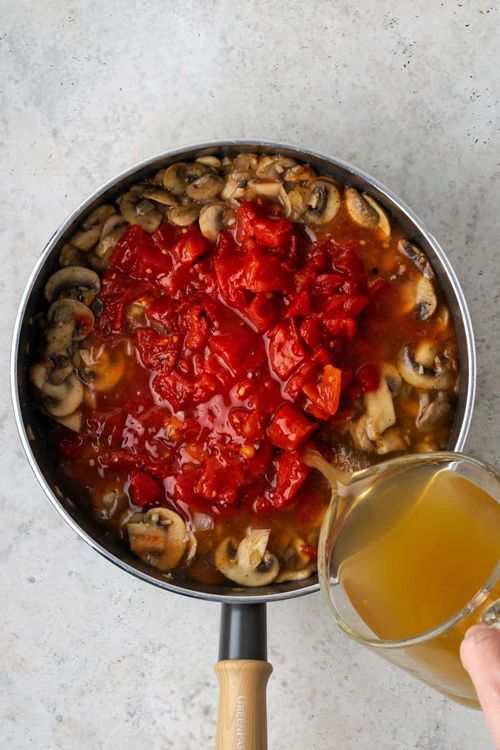 Step 1.1: Increase heat to high then add canned tomatoes and vegetable broth