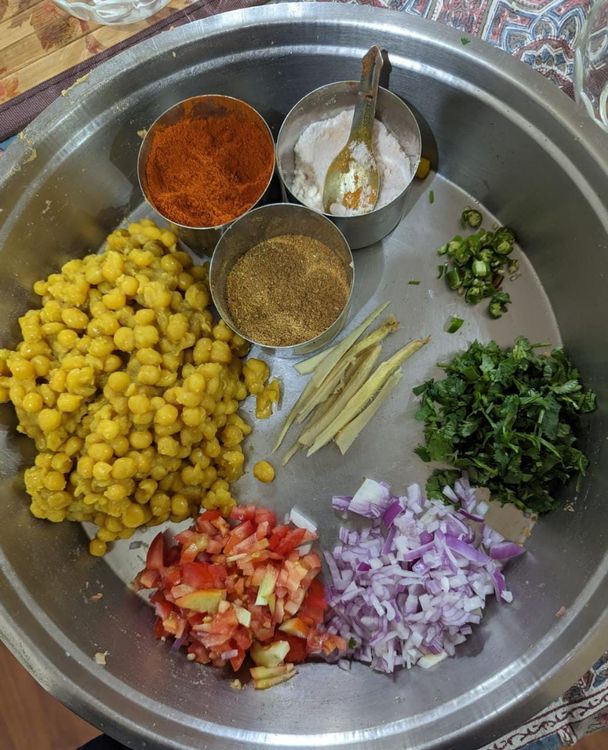 Step 1.1: Add the chopped onions, tomatoes, chilli, coriander, ginger and add the lemon juice to the boiled peas