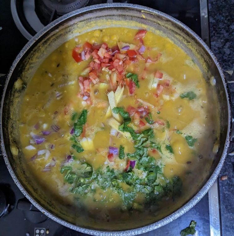 Step 1.2: Add the chopped onions, tomatoes, chilli, coriander, ginger and add the lemon juice to the boiled peas