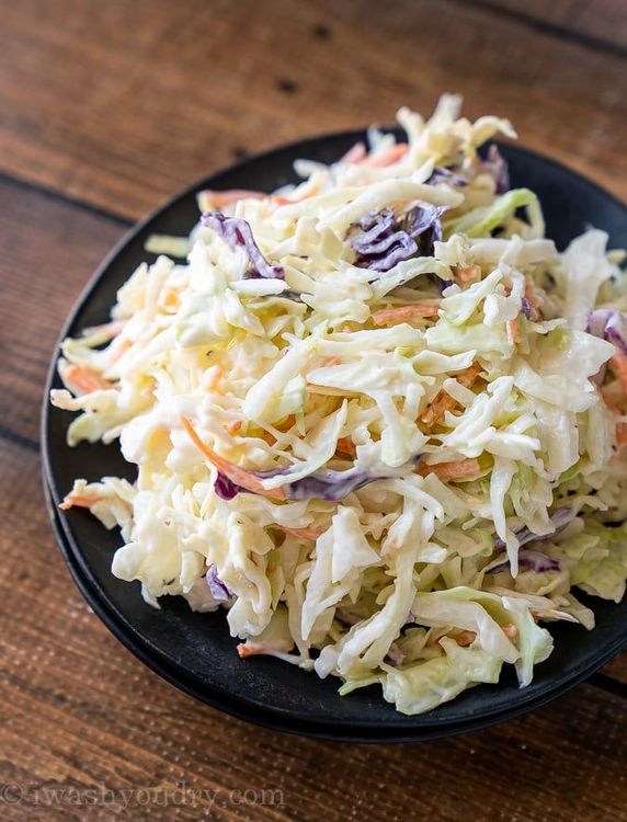 Step 1.1: Add the finely chopped cabbage, shredded carrots, and minced onions to the bowl
