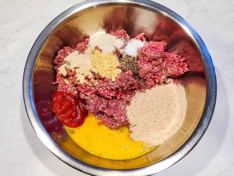 Step 1.1: Add the ground beef, breadcrumbs, dry mustard, onion powder, garlic powder, salt, pepper, ketchup, and egg to a large bowl and mix until well combined