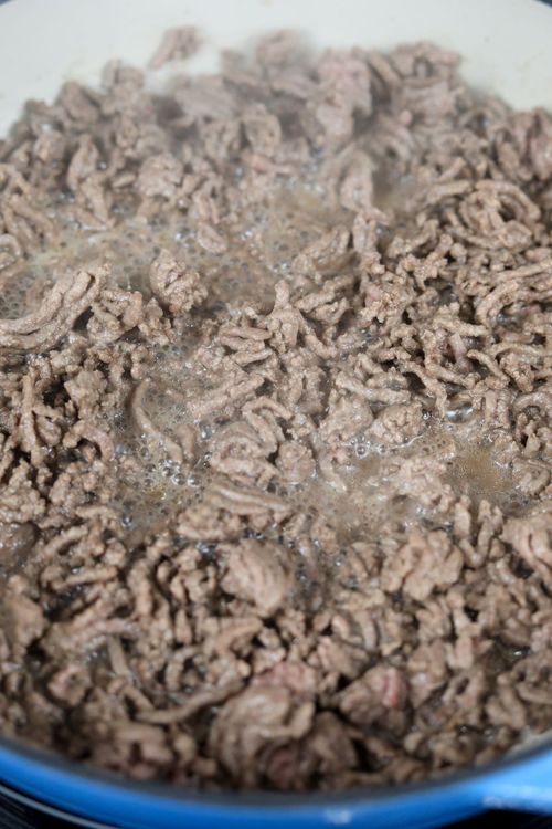 Step 2.1: In a cast iron casserole dish or skillet on medium-high heat, cook the ground beef or lamb until browned