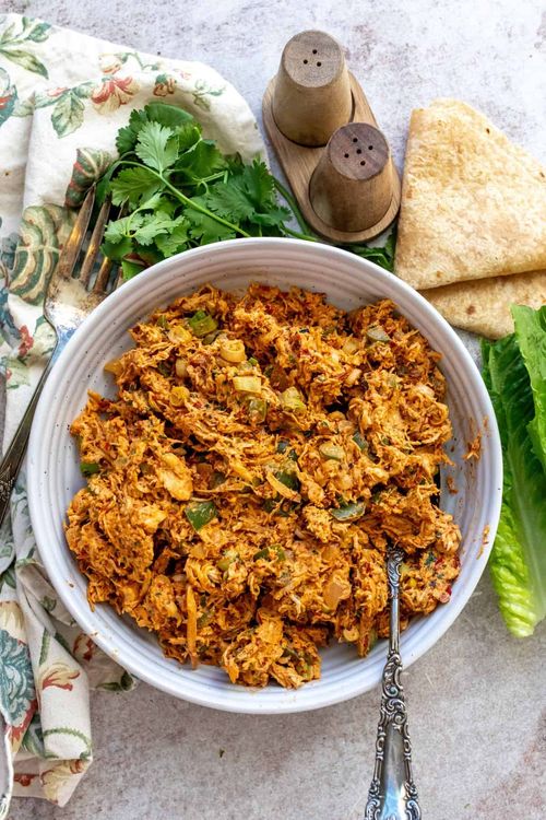 Step 2.1: In a bowl, combine the shredded chicken with the chopped parsley, cilantro, toasted almonds, and beaten eggs