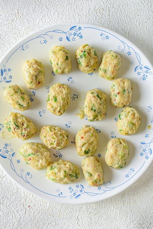 Step 1.1: Portion the dough into small balls and reshape them as tater tots