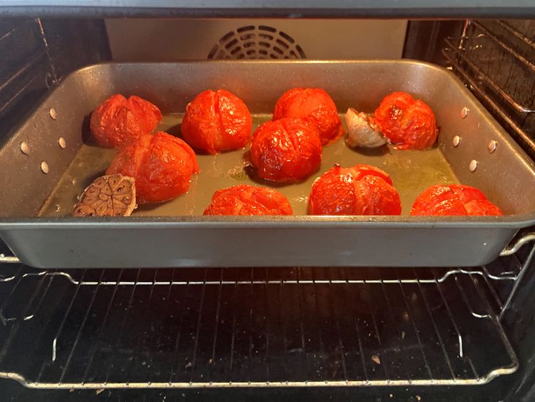 Step 1.1: Once finished roasting, set aside the garlic and peel all the tomatoes, discarding the skins