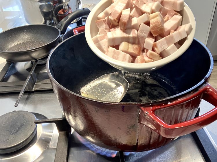 Step 2.4: Heat olive oil over medium-high heat in a heavy-based cast iron pot