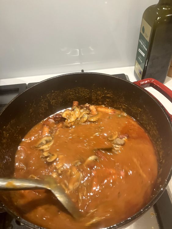 Step 2.2: Add salami, speck and mushrooms to the pot then mix and cook uncovered for another 30 minutes