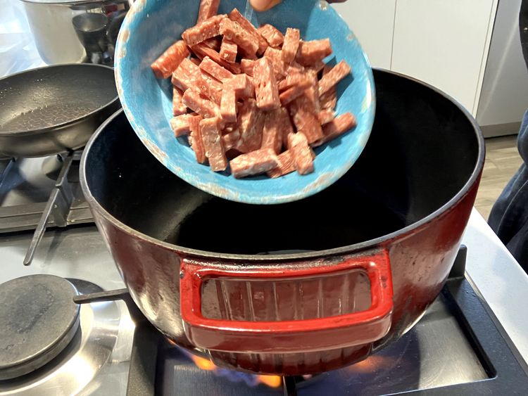 Step 2.1: Heat olive oil over medium-high heat in a heavy-based cast iron pot