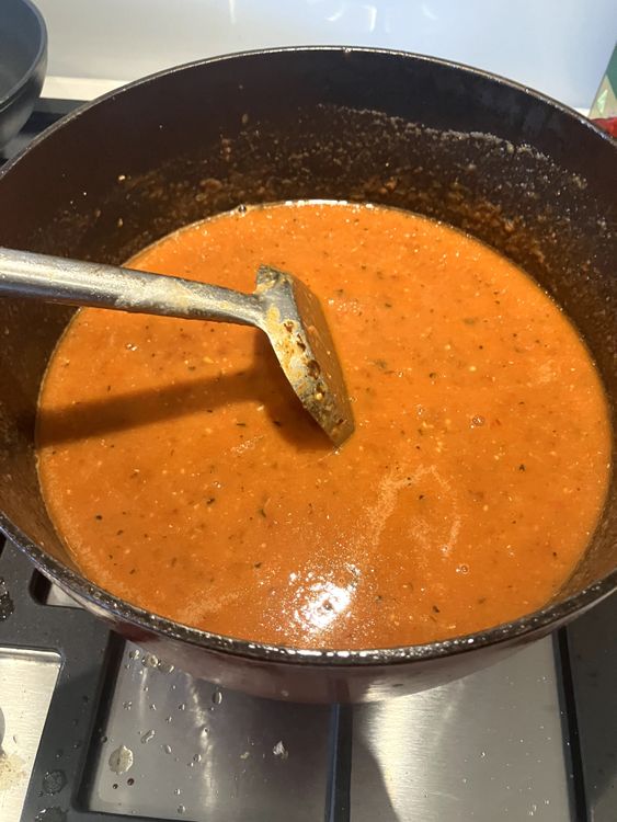 Step 2.4: Add the beef stock, white sugar and tomato puree, mixing everything together