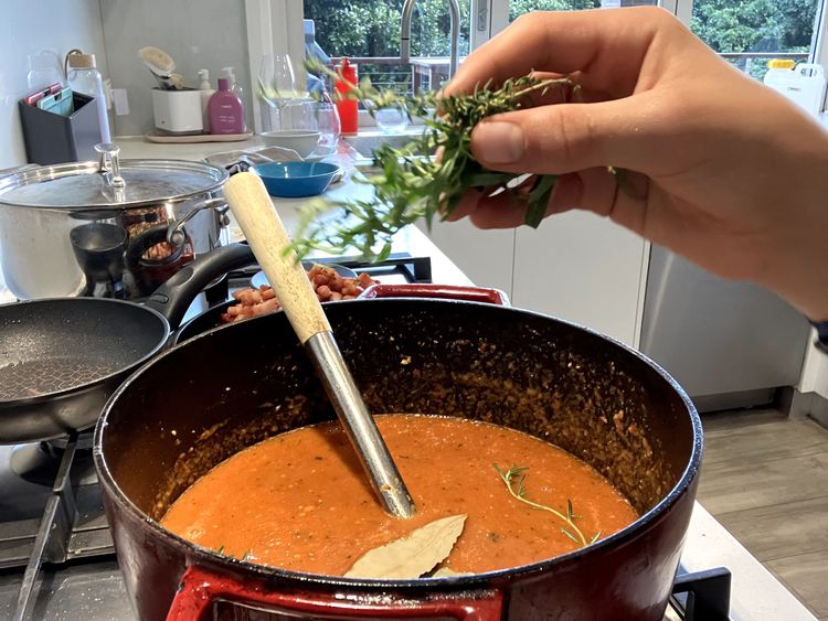 Step 2.6: Add the beef stock, white sugar and tomato puree, mixing everything together