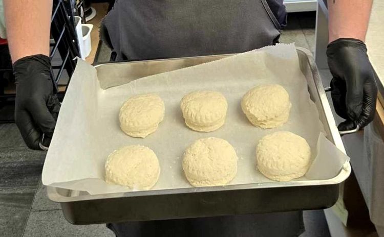 Step 3.1: Using a round cutter (about 6cm), cut out scones and place them upside-down on the tray, spacing them slightly apart